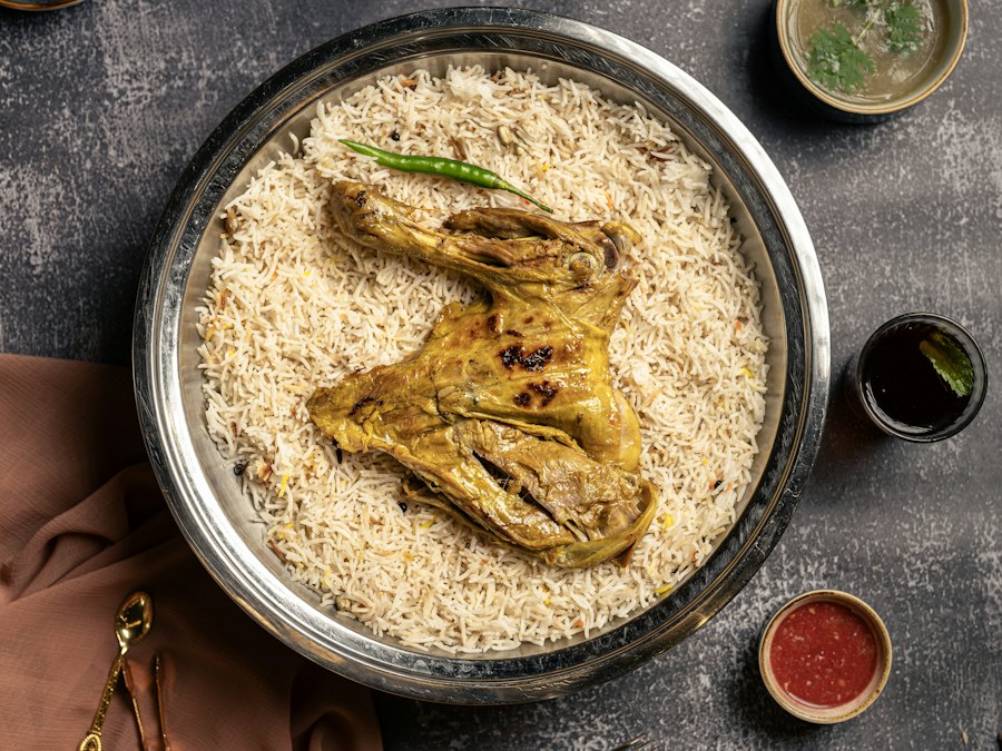 Chicken mandi on a tray of rice
