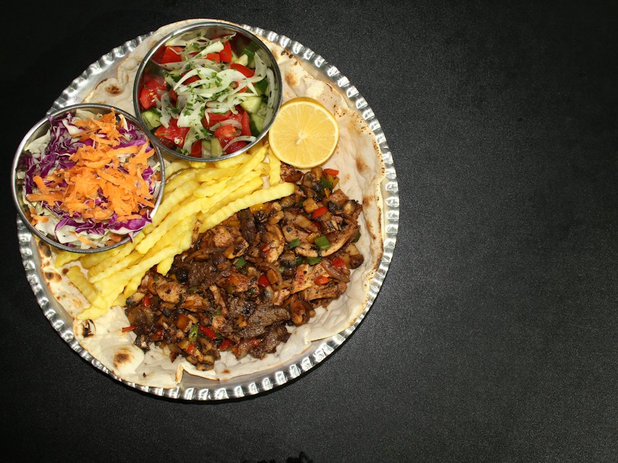 Shawarma plate with fries, salad and pita